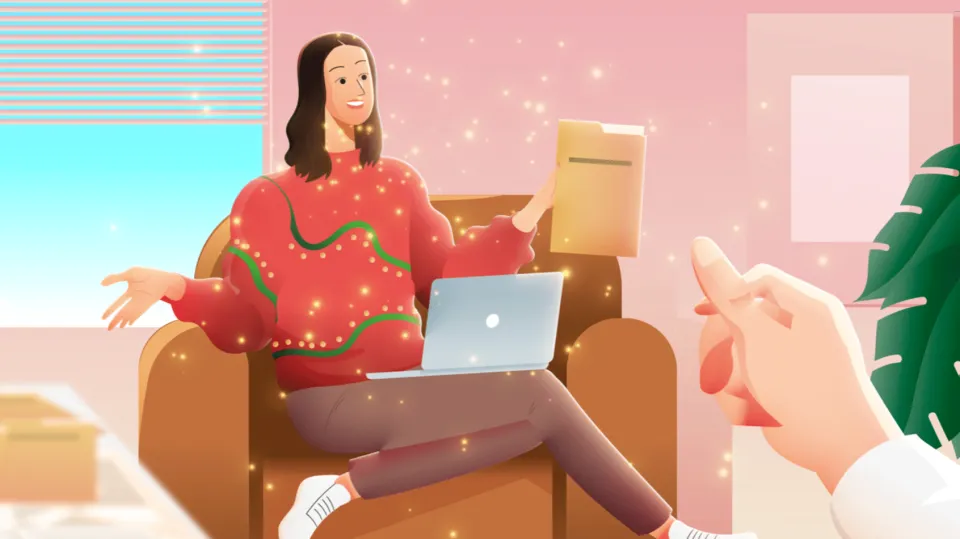 Woman in a glowing Christmas sweater sits in an armchair with a laptop and hands a folder to someone.